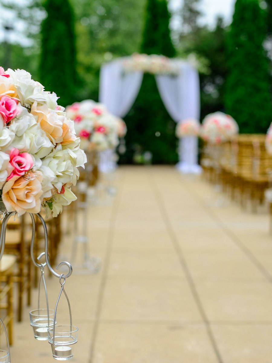 Flowers lining the aisle toward the ceremony